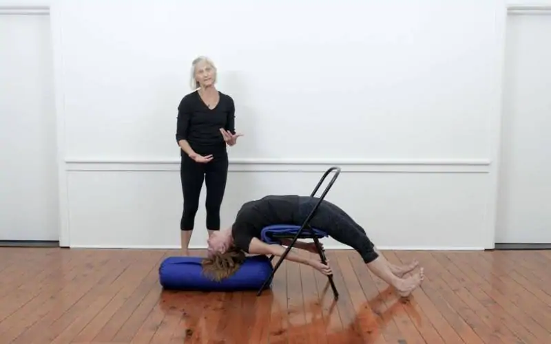 Iyengar yoga video thumbnail: Dvi Pada Viparita Dandasana (Over chair, hands to chair legs)