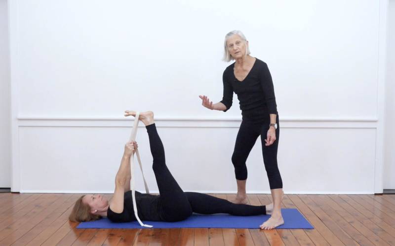 Revolved Supine Hand to Toe Pose