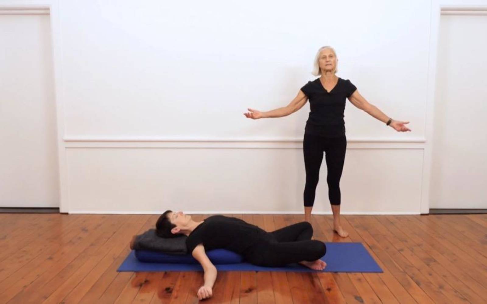 Premium Photo  Woman performing a variation of the uttanasana or standing  forward bend yoga pose for thigh