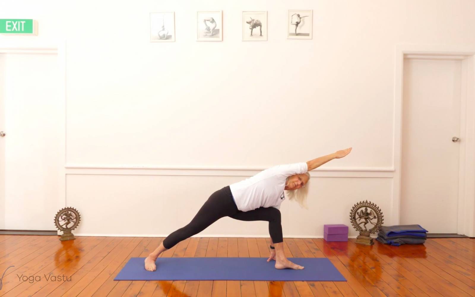 Premium Photo | Woman practicing yoga doing variation of utthita  parshvakonasana exercise angle pose