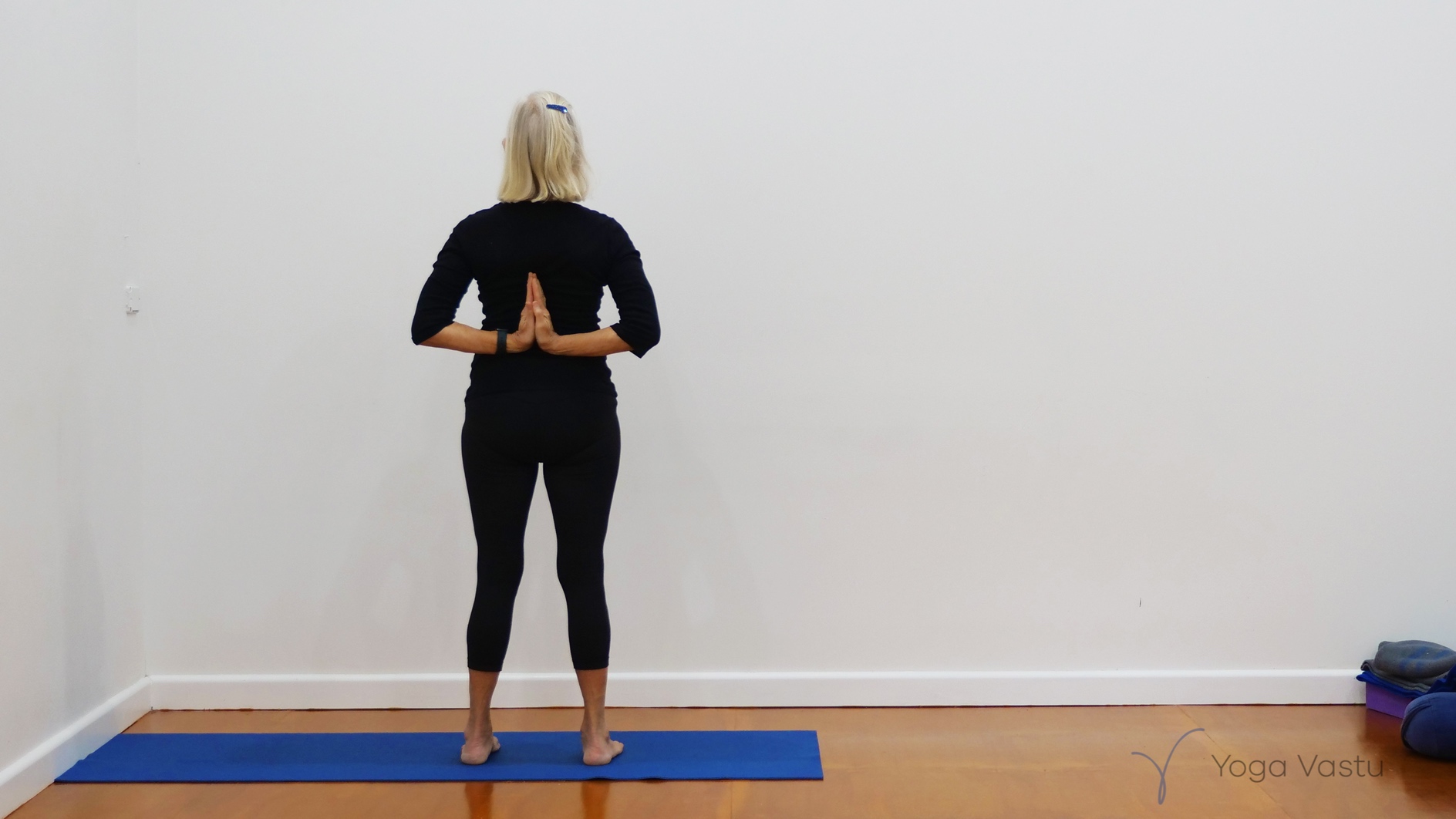 Standing poses with wall support for general level students - Yoga Vastu